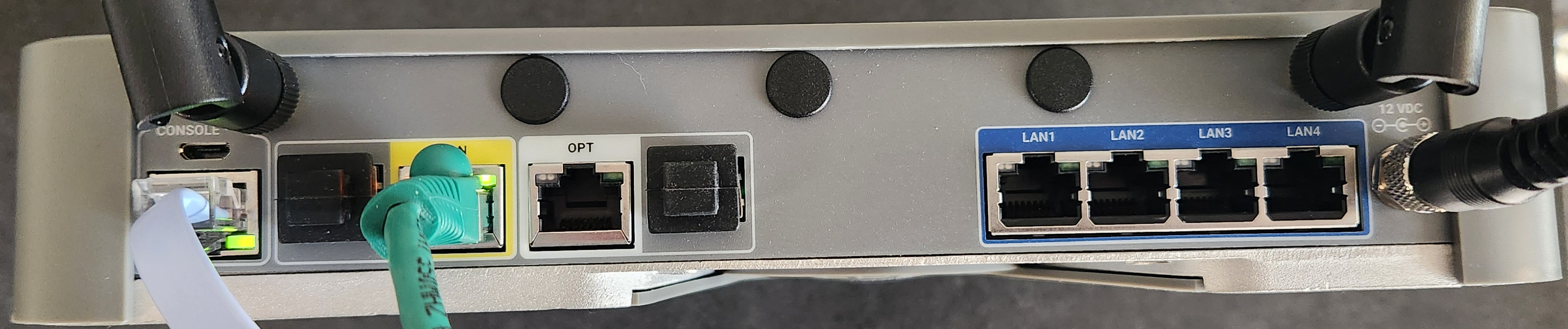 Rear of the XG ESD showing the console, WAN, OPT, LAN1 to LAN4 ports and the 12 VDC power input